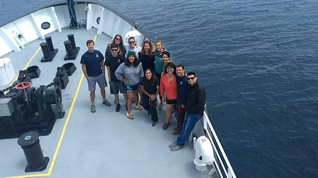 Professor Beman, left, and his research colleagues at sea.